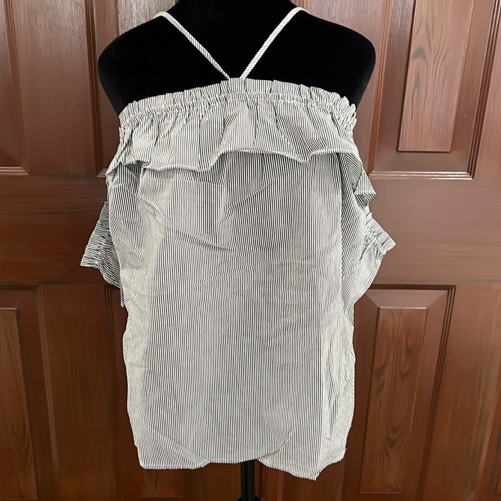 NWOT Women’s large, black and white striped spaghetti strap top.